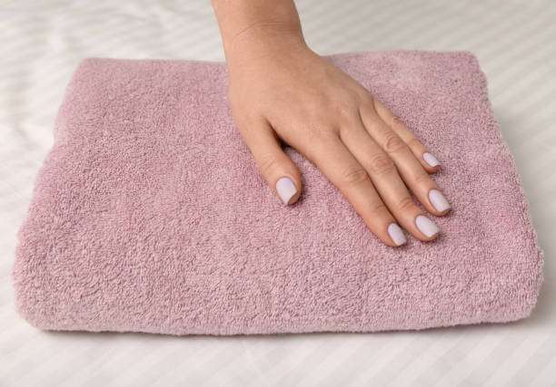 Woman touching soft bath mat