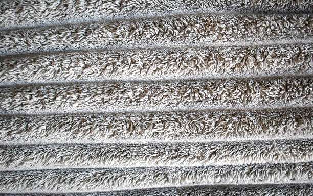 Close-up of a textured grey ribbed fabric, ideal for a soft and absorbent bath mat.